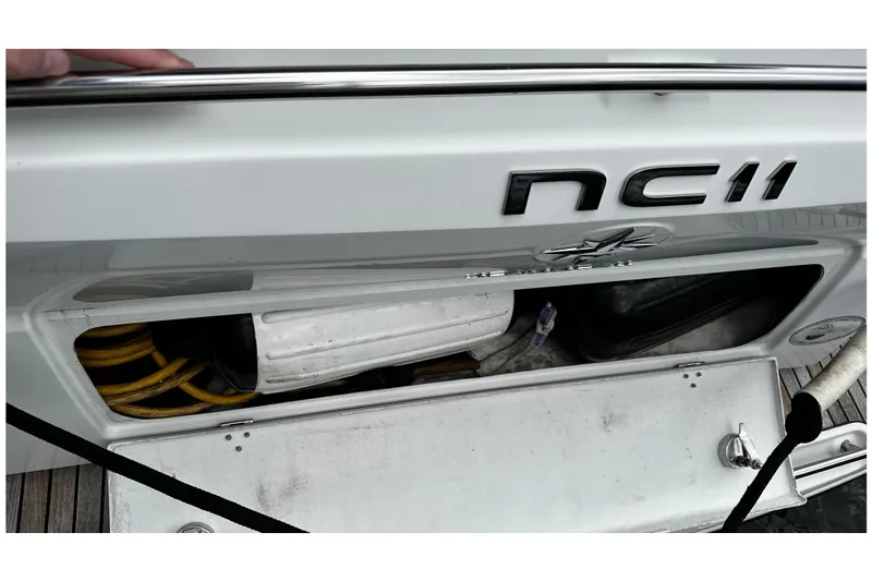 Andalucia Yacht Photos Pics 2017 Jeanneau NC 11 boat storage compartment with cables and equipment.