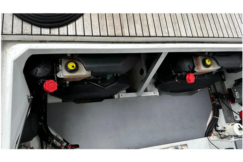 Andalucia Yacht Photos Pics Engine compartment of 2017 Jeanneau NC 11 boat, showcasing dual engines and components.