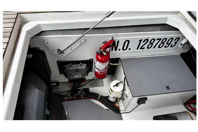 Andalucia Yacht Photos Pics Engine compartment of a 2017 Jeanneau NC 11 with fire extinguisher and equipment.