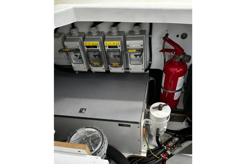 Andalucia Yacht Photos Pics Engine compartment of 2017 Jeanneau NC 11 with fire extinguisher and electrical components.