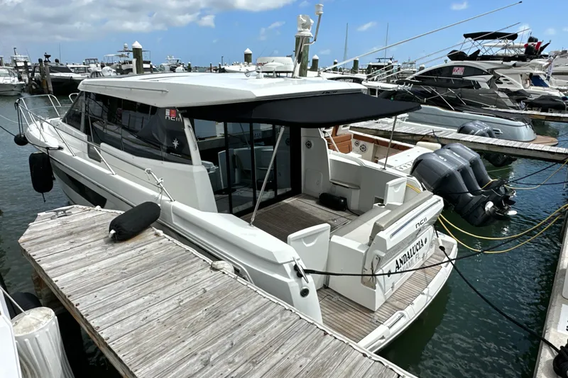 Andalucia Yacht Photos Pics 2017 Jeanneau NC 11 yacht docked at marina, featuring sleek design and modern amenities.