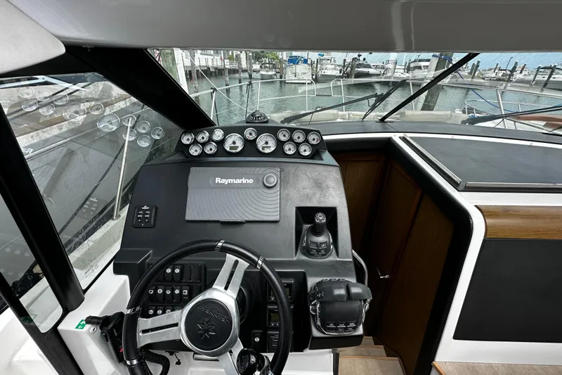 Andalucia Yacht Photos Pics Steering console of 2017 Jeanneau NC 11 boat with Raymarine navigation system.