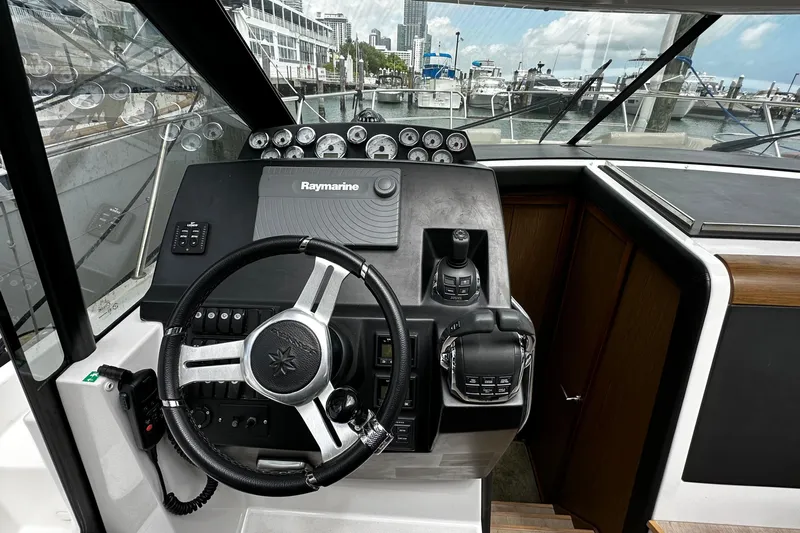 Andalucia Yacht Photos Pics 2017 Jeanneau NC 11 helm with Raymarine navigation, docked at marina.