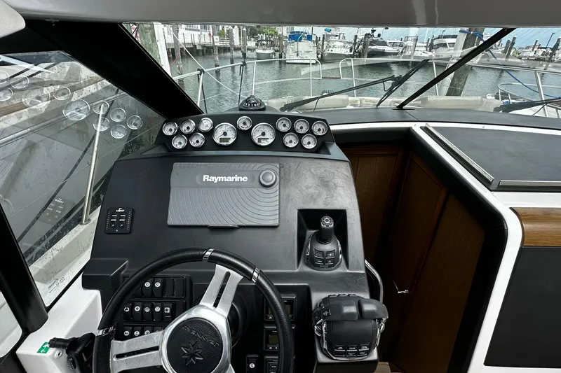 Andalucia Yacht Photos Pics Cockpit of 2017 Jeanneau NC 11 boat with Raymarine navigation system.