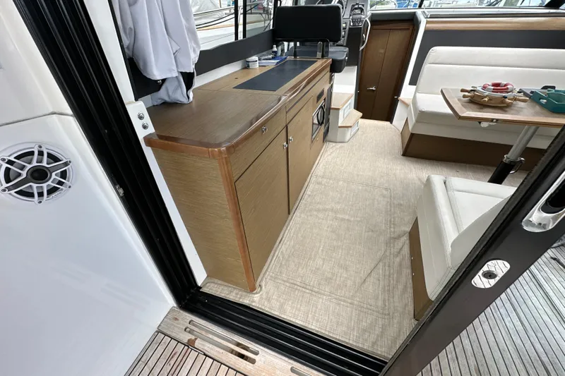 Andalucia Yacht Photos Pics Interior of 2017 Jeanneau NC 11 boat with modern seating and cabinetry.
