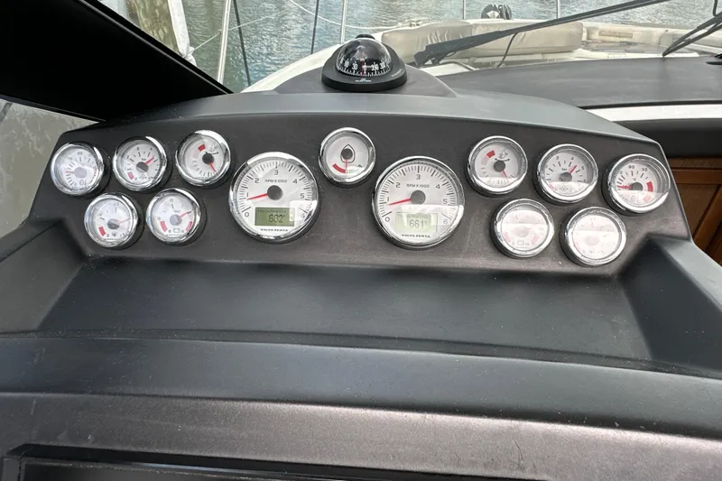 Andalucia Yacht Photos Pics Dashboard of a 2017 Jeanneau NC 11 boat with multiple gauges and compass.
