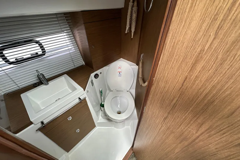 Andalucia Yacht Photos Pics Bathroom interior of 2017 Jeanneau NC 11 yacht with sink and toilet.