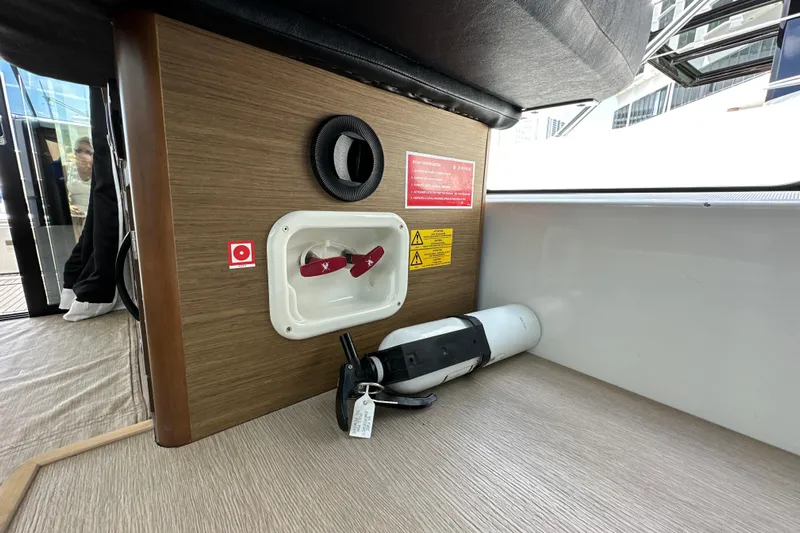 Andalucia Yacht Photos Pics 2017 Jeanneau NC 11 interior with safety equipment and fire extinguisher.