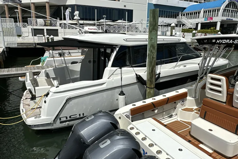 Andalucia Yacht Photos Pics 2017 Jeanneau NC 11 boat docked at marina, featuring sleek design and modern amenities.
