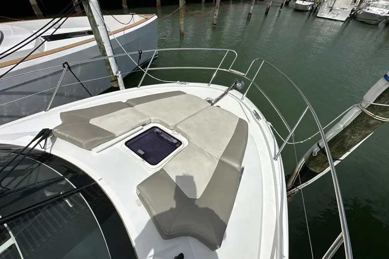Andalucia Yacht Photos Pics 2017 Jeanneau NC 11 boat with cushioned deck, docked in marina.