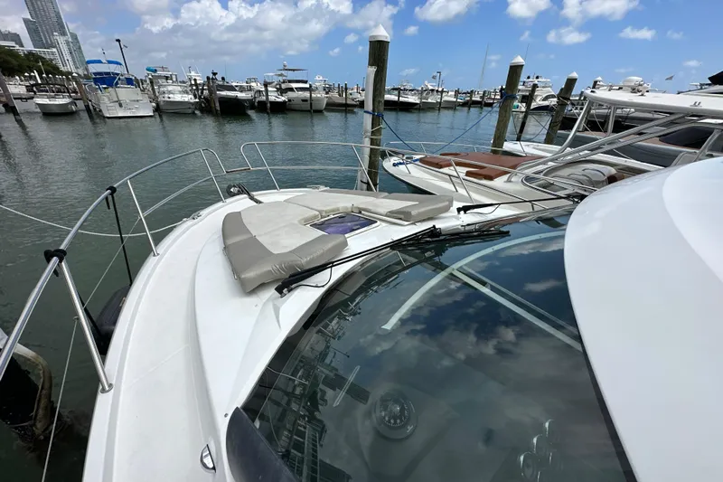 Andalucia Yacht Photos Pics 2017 Jeanneau NC 11 yacht docked at marina under blue sky.