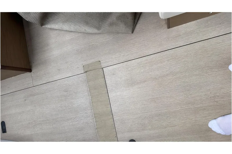 Andalucia Yacht Photos Pics Interior flooring of 2017 Jeanneau NC 11 boat, featuring light wood finish.