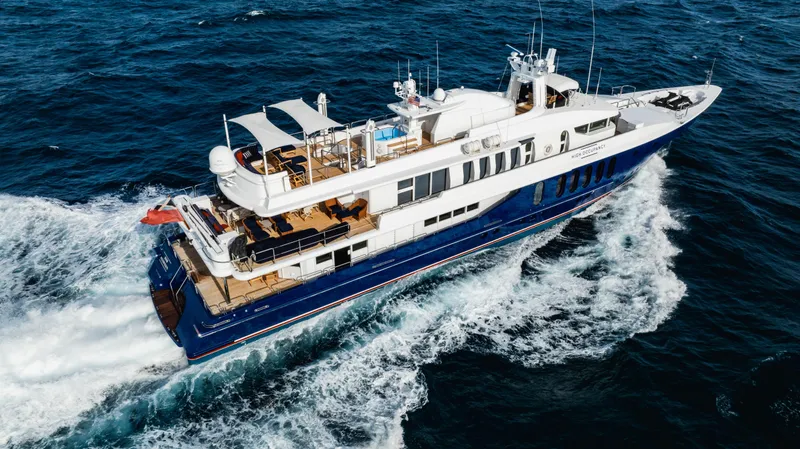 High Occupancy Yacht Photos Pics Luxurious 1989 Oceanfast Custom yacht cruising on open sea, showcasing elegant design and spacious decks.