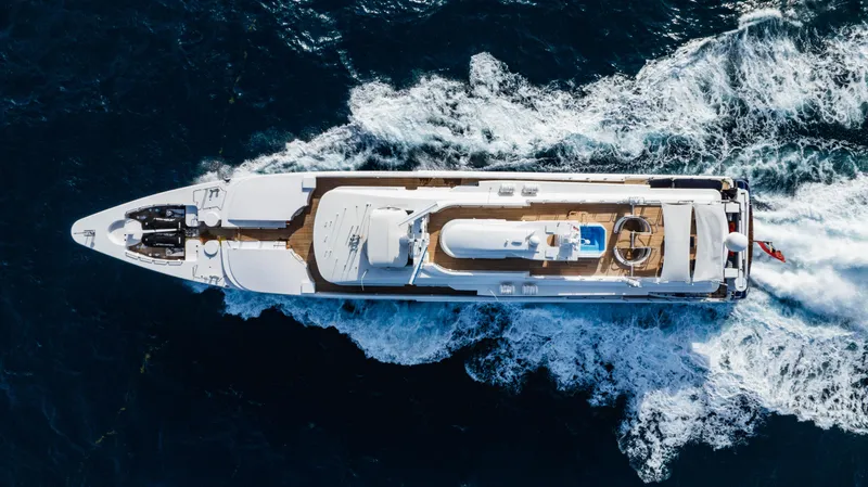 High Occupancy Yacht Photos Pics Aerial view of 1989 Oceanfast Custom yacht cruising through ocean waves.