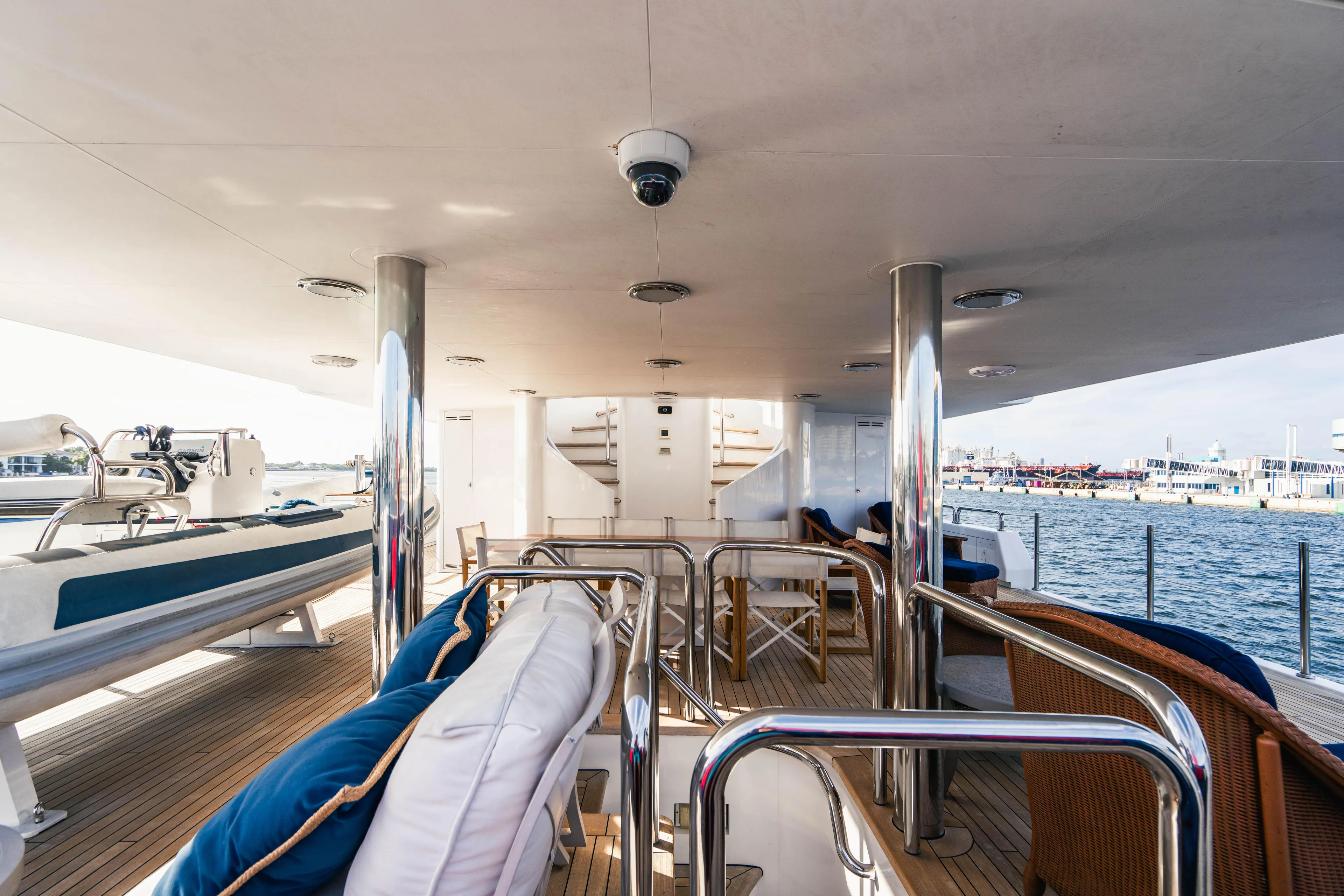High Occupancy Yacht Photos Pics Luxurious 1989 Oceanfast Custom yacht deck with seating, overlooking serene waters.