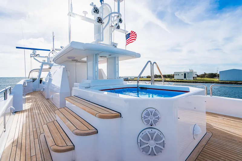 High Occupancy Yacht Photos Pics Luxurious 1989 Oceanfast Custom yacht deck with pool and American flag.