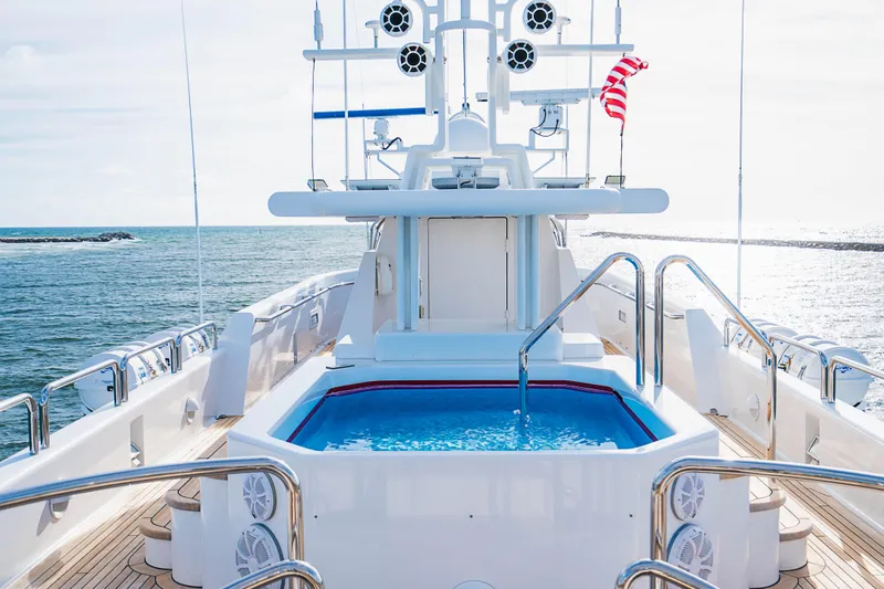 High Occupancy Yacht Photos Pics Luxurious 1989 Oceanfast Custom yacht with pool, ocean view, and American flag.