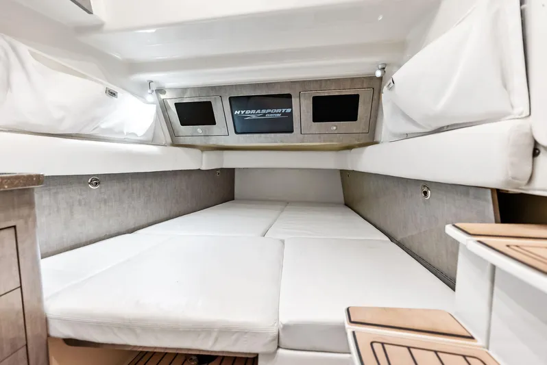 Verdandi Yacht Photos Pics Interior cabin of 2018 HCB 53 Sue&ntilde;os boat with white cushioned seating.