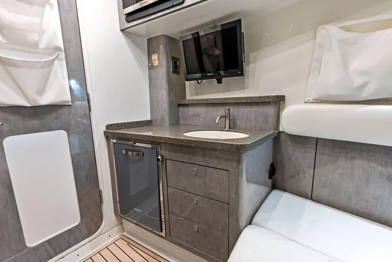 Verdandi Yacht Photos Pics Interior of 2018 HCB 53 Sue&ntilde;os yacht with kitchenette, sink, and seating area.