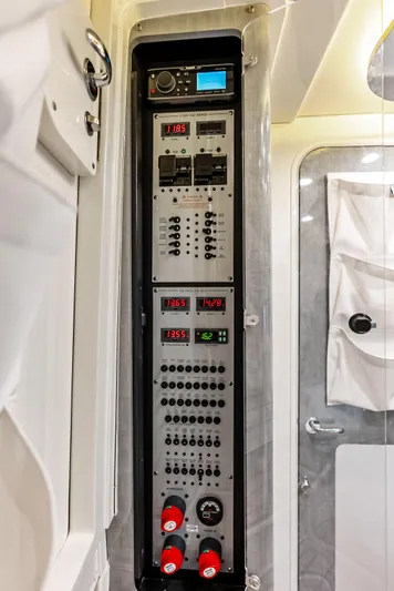 Verdandi Yacht Photos Pics Control panel inside 2018 HCB 53 Sue&ntilde;os boat, featuring various switches and digital displays.