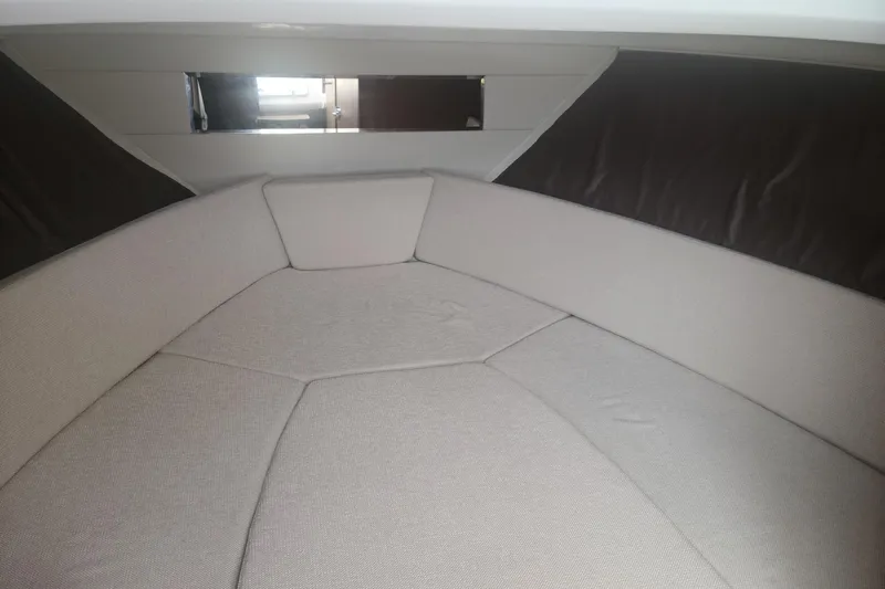  Yacht Photos Pics Interior cabin of 2020 Jeanneau Leader 9.0 WA with cushioned seating.