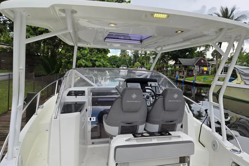  Yacht Photos Pics 2020 Jeanneau Leader 9.0 WA boat interior with helm, seats, and canopy.