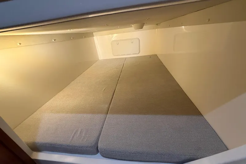  Yacht Photos Pics 2026 NorthCoast 255 Cabin interior with cushioned sleeping area, well-lit and spacious.