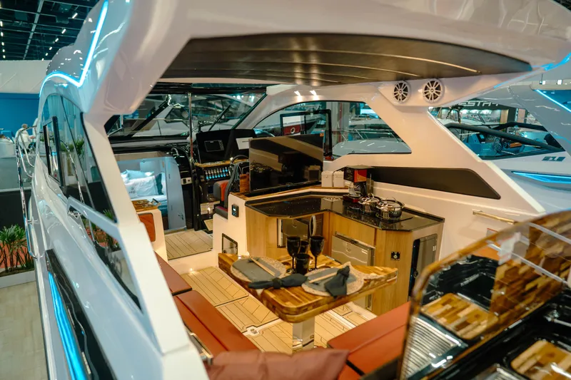  Yacht Photos Pics Luxurious interior of 2025 NHD 365 HT PLUS yacht with modern kitchen and seating area.