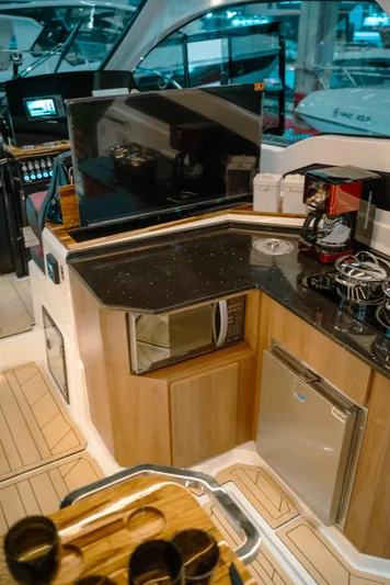  Yacht Photos Pics Modern kitchen area on 2025 NHD 365 HT PLUS yacht with appliances and sleek design.
