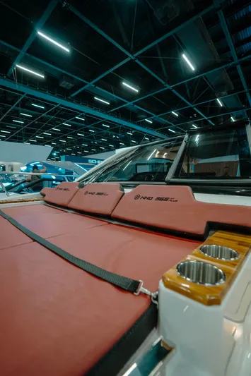  Yacht Photos Pics 2025 NHD 365 HT PLUS boat interior with red seating and cup holders.