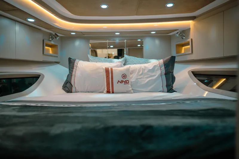  Yacht Photos Pics Luxurious interior of 2025 NHD 365 HT PLUS yacht with elegant bedding and ambient lighting.