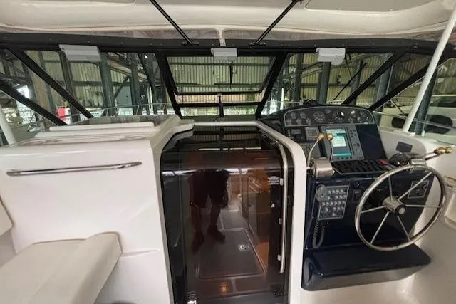 Ocean Cloud Yacht Photos Pics 2001 Tiara Yachts 3500 Open cockpit with steering wheel and control panel.