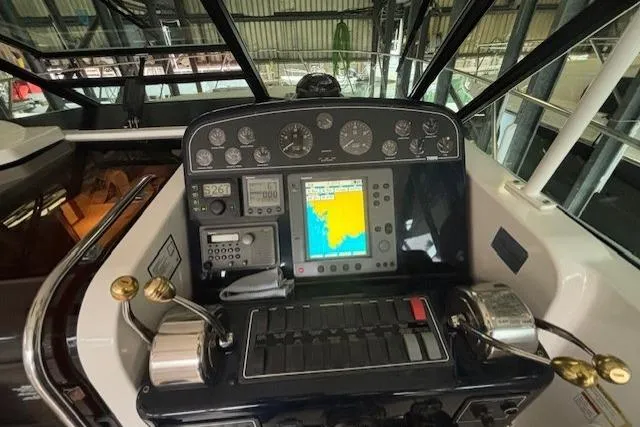 Ocean Cloud Yacht Photos Pics Helm of 2001 Tiara Yachts 3500 Open with navigation instruments and controls.