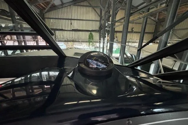 Ocean Cloud Yacht Photos Pics 2001 Tiara Yachts 3500 Open compass view inside a boat storage facility.