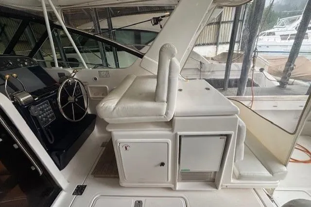 Ocean Cloud Yacht Photos Pics 2001 Tiara Yachts 3500 Open helm with white seating and steering wheel.