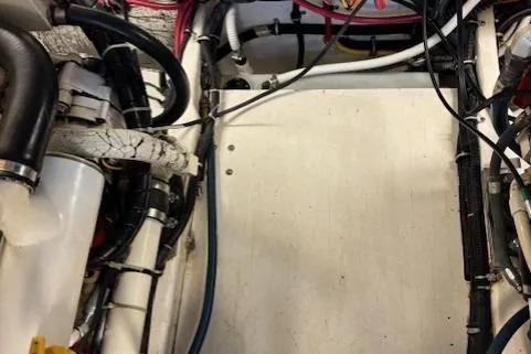 Ocean Cloud Yacht Photos Pics Engine compartment of a 2001 Tiara Yachts 3500 Open, showcasing wiring and hoses.
