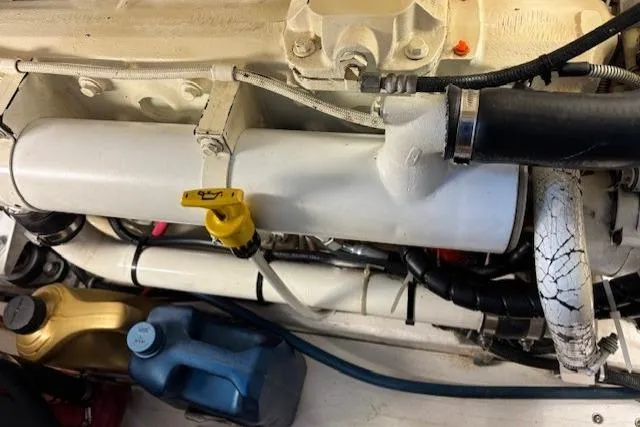 Ocean Cloud Yacht Photos Pics Engine compartment of a 2001 Tiara Yachts 3500 Open, showing hoses and fluid containers.