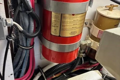 Ocean Cloud Yacht Photos Pics Engine room of 2001 Tiara Yachts 3500 Open with fire extinguisher and wiring.