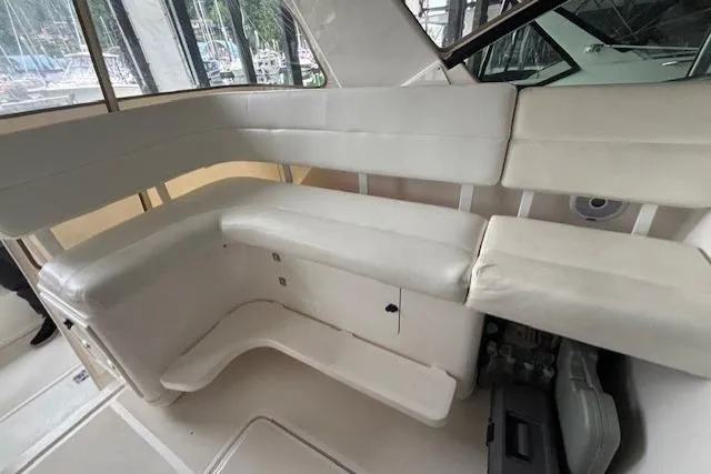 Ocean Cloud Yacht Photos Pics 2001 Tiara Yachts 3500 Open interior with white seating and storage compartments.
