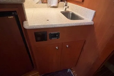 Ocean Cloud Yacht Photos Pics 2001 Tiara Yachts 3500 Open galley with sink and cabinetry.