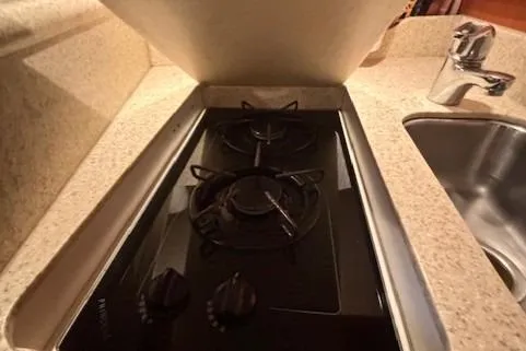 Ocean Cloud Yacht Photos Pics 2001 Tiara Yachts 3500 Open kitchen with stove and sink.