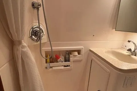 Ocean Cloud Yacht Photos Pics Bathroom interior of 2001 Tiara Yachts 3500 Open, featuring shower and sink area.