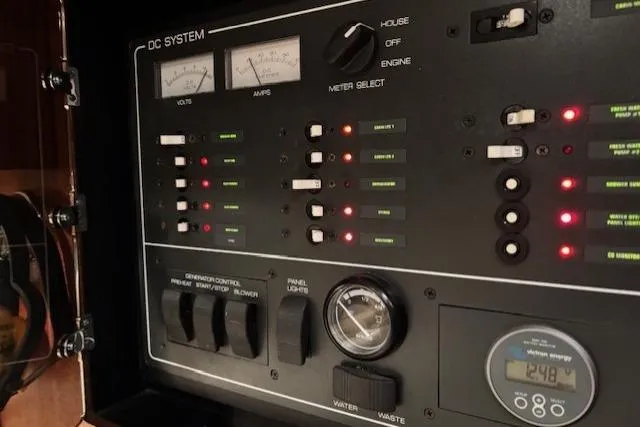 Ocean Cloud Yacht Photos Pics Control panel of a 2001 Tiara Yachts 3500 Open, showing DC system gauges and switches.