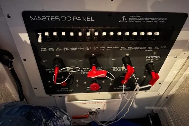 Ocean Cloud Yacht Photos Pics Master DC panel on 2001 Tiara Yachts 3500 Open, featuring switches and warning labels.