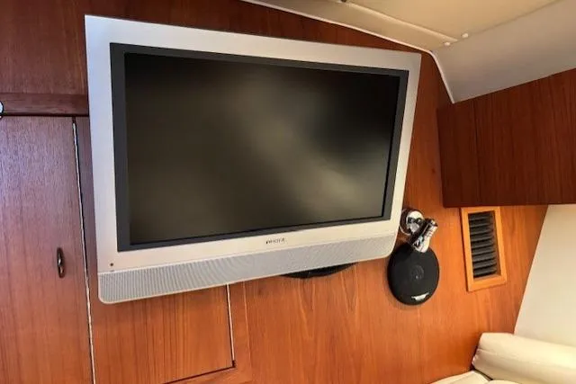 Ocean Cloud Yacht Photos Pics Flat-screen TV in 2001 Tiara Yachts 3500 Open cabin interior.