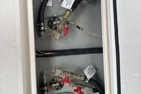 Ocean Cloud Yacht Photos Pics 2001 Tiara Yachts 3500 Open engine compartment with hoses and valves.