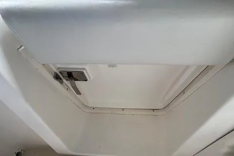 Ocean Cloud Yacht Photos Pics Hatch interior of 2001 Tiara Yachts 3500 Open, showcasing clean design and secure latch.