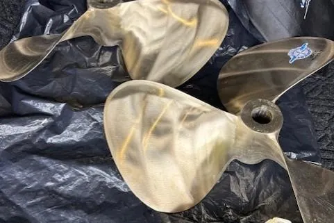 Ocean Cloud Yacht Photos Pics Propellers of a 2001 Tiara Yachts 3500 Open on a tarp.