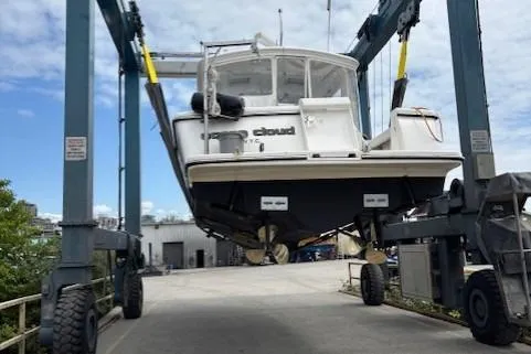 Ocean Cloud Yacht Photos Pics 2001 Tiara Yachts 3500 Open on a lift, showcasing its hull and structure.
