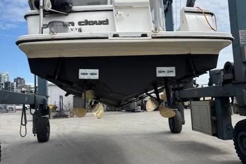 Ocean Cloud Yacht Photos Pics 2001 Tiara Yachts 3500 Open on lift, showcasing hull and propellers.